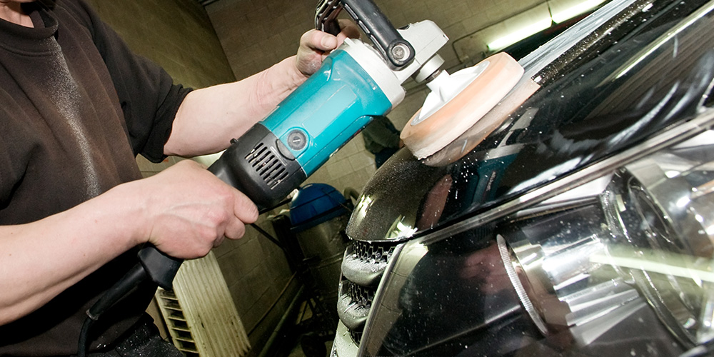 Image of Employee Working on A Car